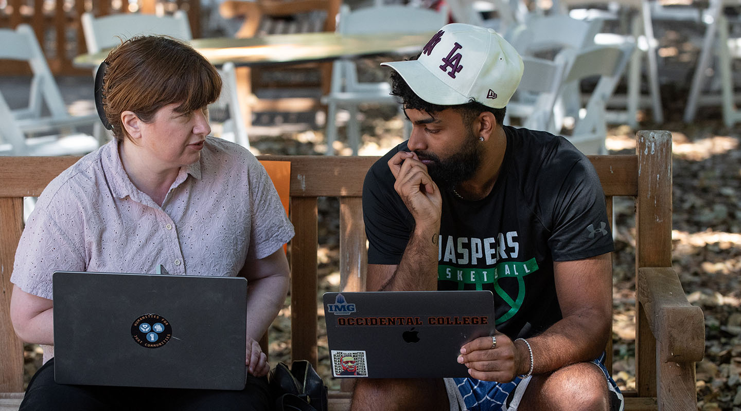 An Occidental College student talking to their academic adviser