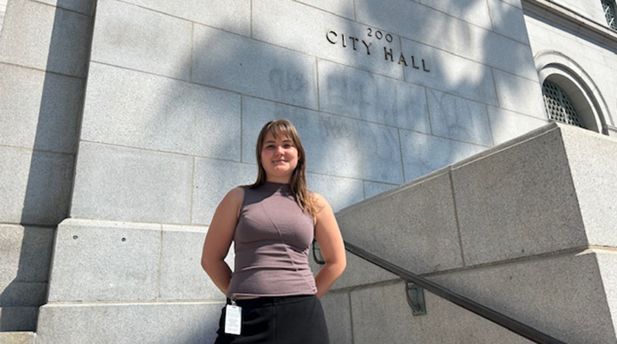 Occidental student in front of City Hall