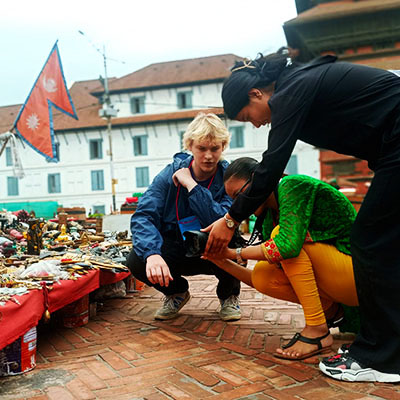 Occidental College student Truman Urness '25 in Nepal at a local market
