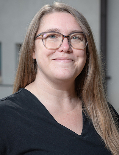 Madeline Wander headshot with black vneck shirt