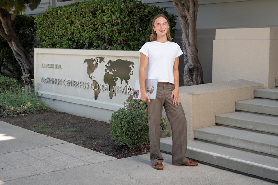 an occidental student stands outside of Johnson Hall on the Occidental LA campus