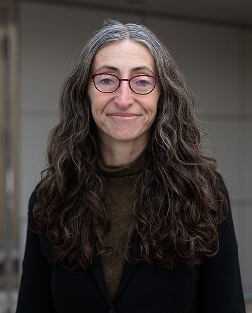 Yelena Gluzman in a black sweater and long hair