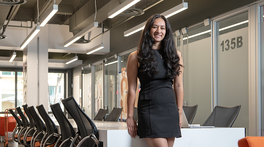 ASOC President Trisha Bhima standing in the ASOC office at Occidental College