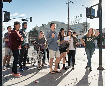 Occidental College students waiting at an intersection in the Highland Park neighborhood of LA