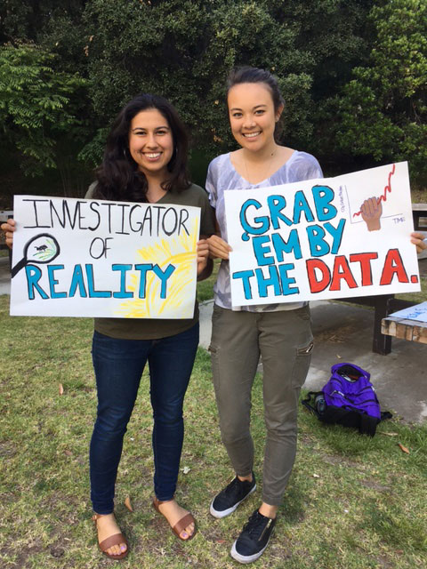 Students proudly holding their signs