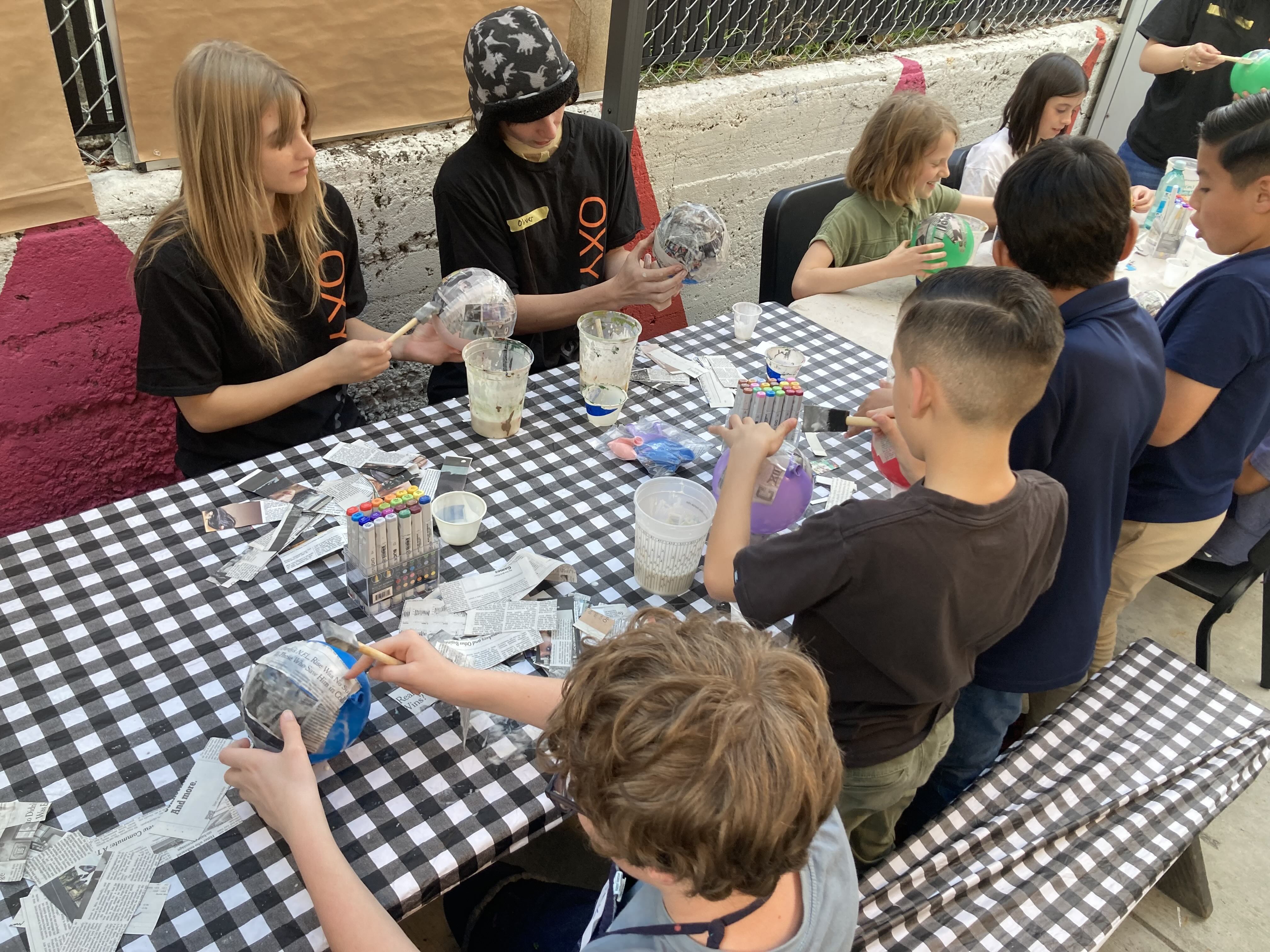 EDUC 100/ARTS 143: Art Education Practicum students create piñatas&nbsp;with local school children.&nbsp;