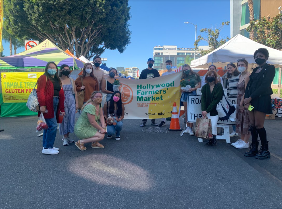 Students in front of Hollywood Farmers Market sign
