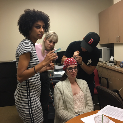 Photo of students conducting EEG research