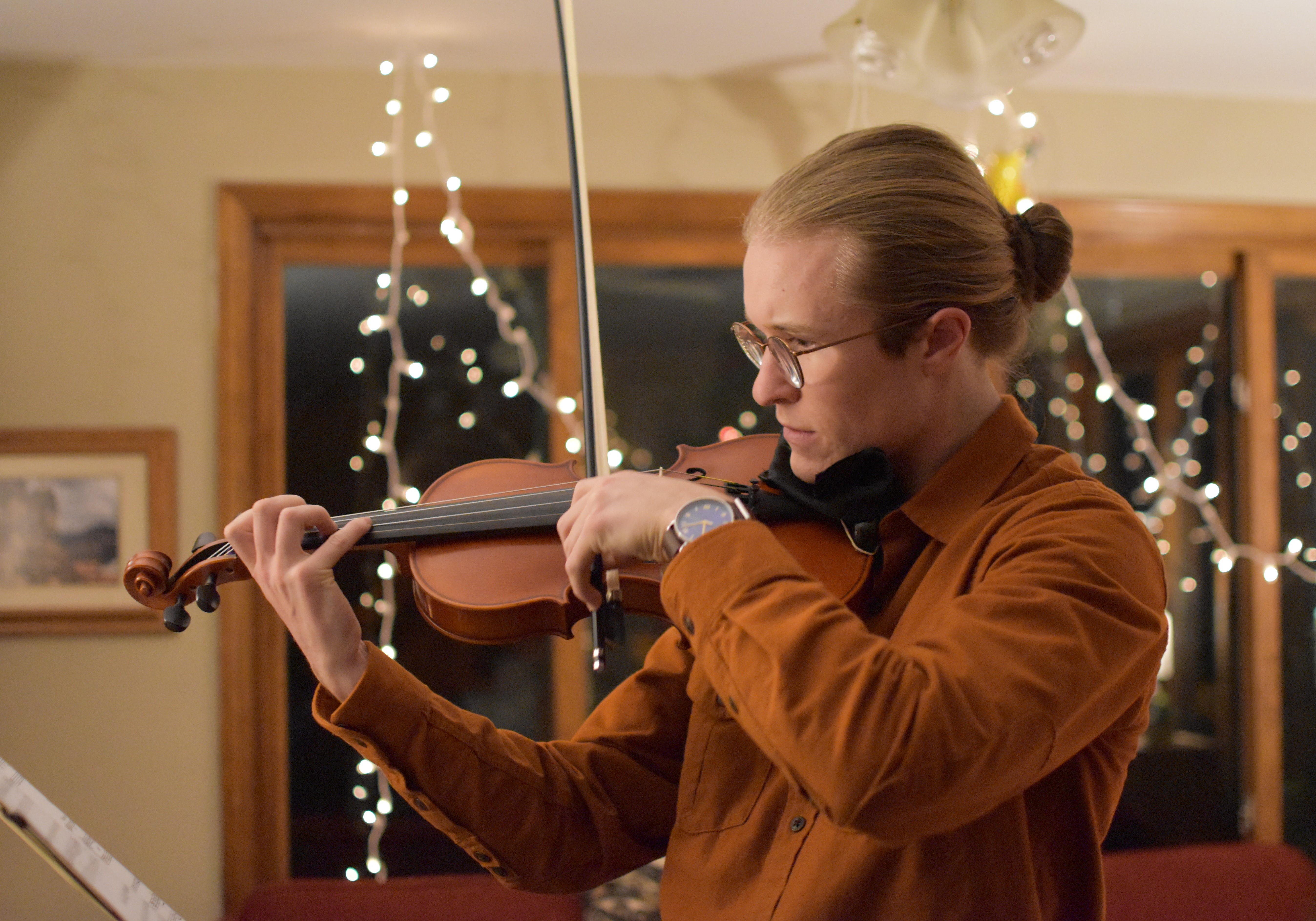Trevor Mairs '22 playing his violin at home