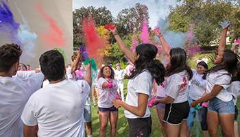 Students participate in the Hindu holiday of Holi on Oxy's c