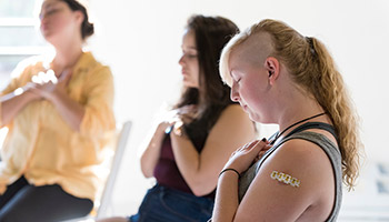 Students in an empowerment and mindfulness workshop on campu