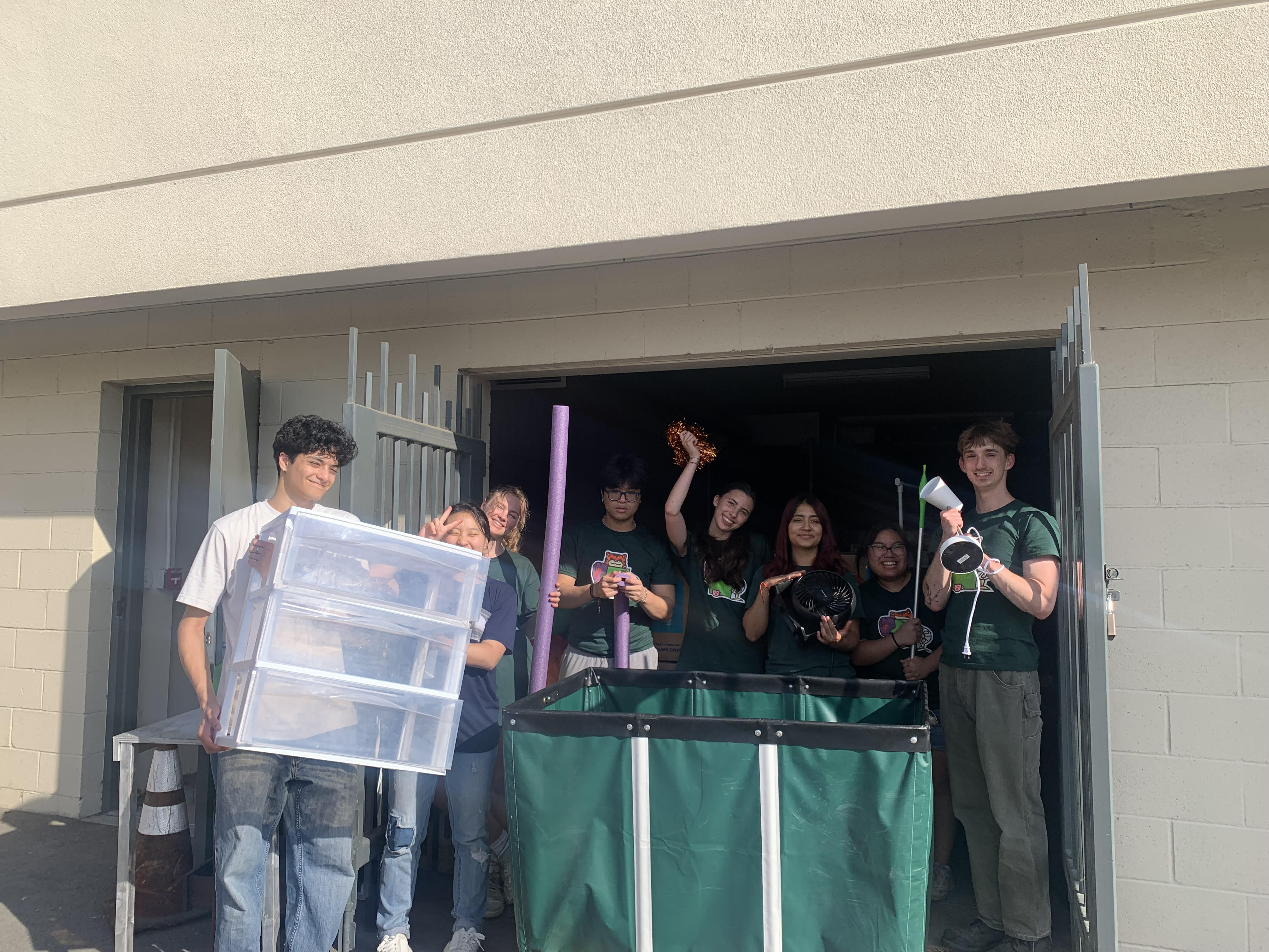 Green Move Out student volunteers holding donated dorm goods!