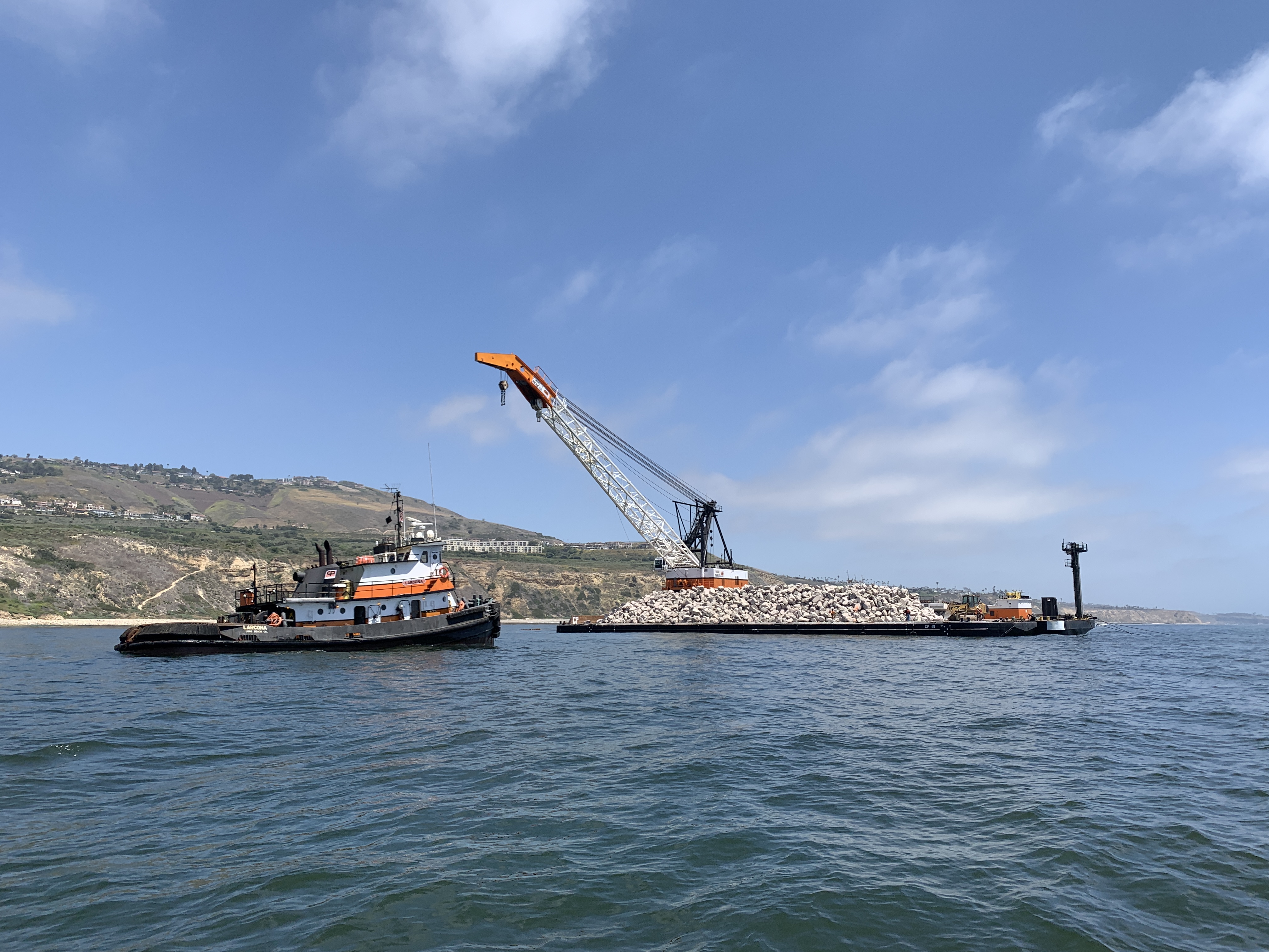 crane, barge, and tugboat off Palos Verdes