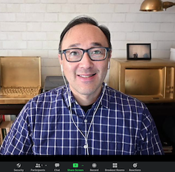 Marc Campos in a Zoom window, smiling