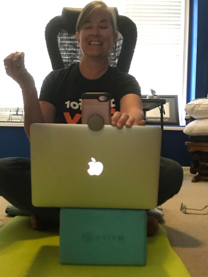 Teresa Williams sitting in front of her open laptop