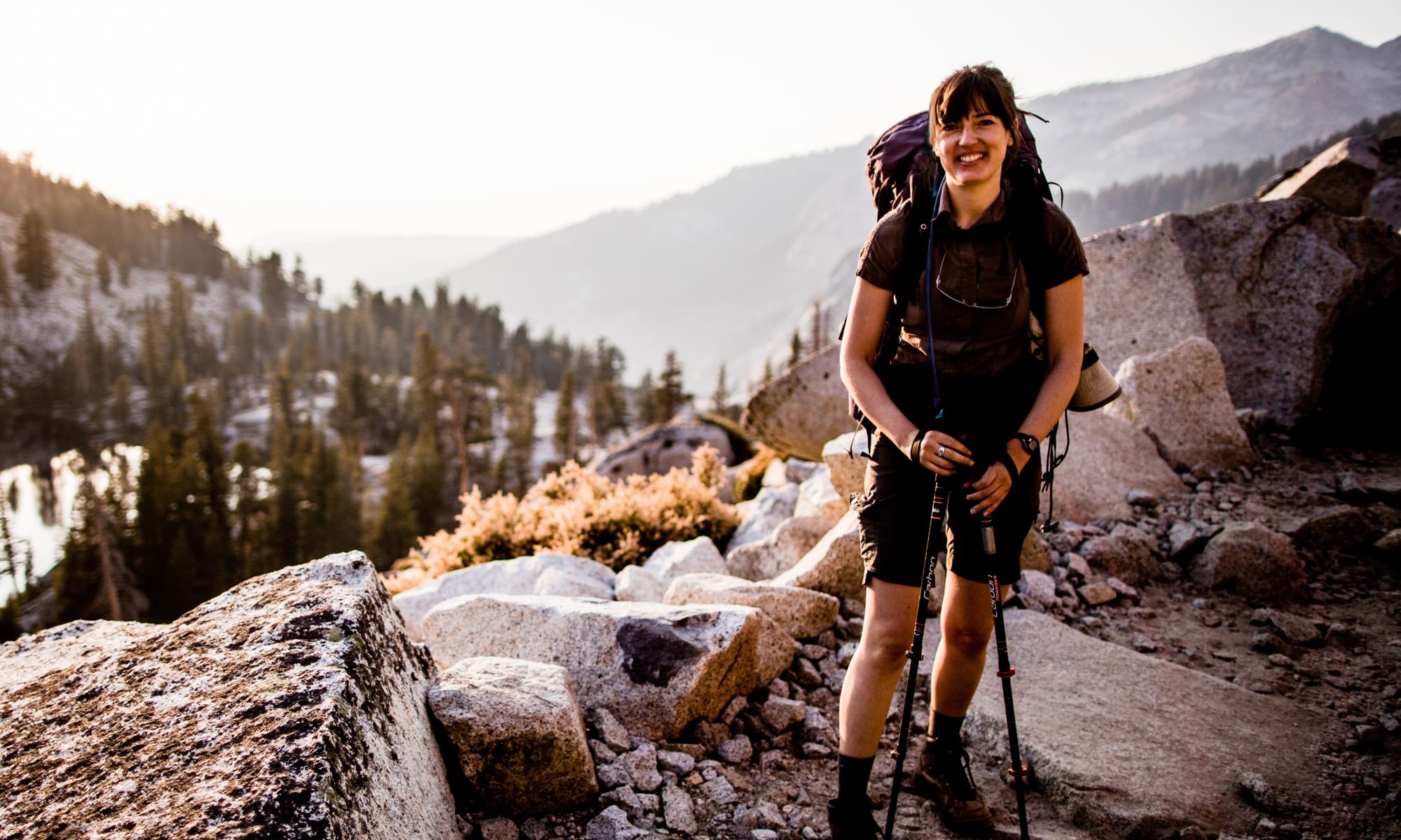 Dr. Joan Dudney in front of mountains and trees