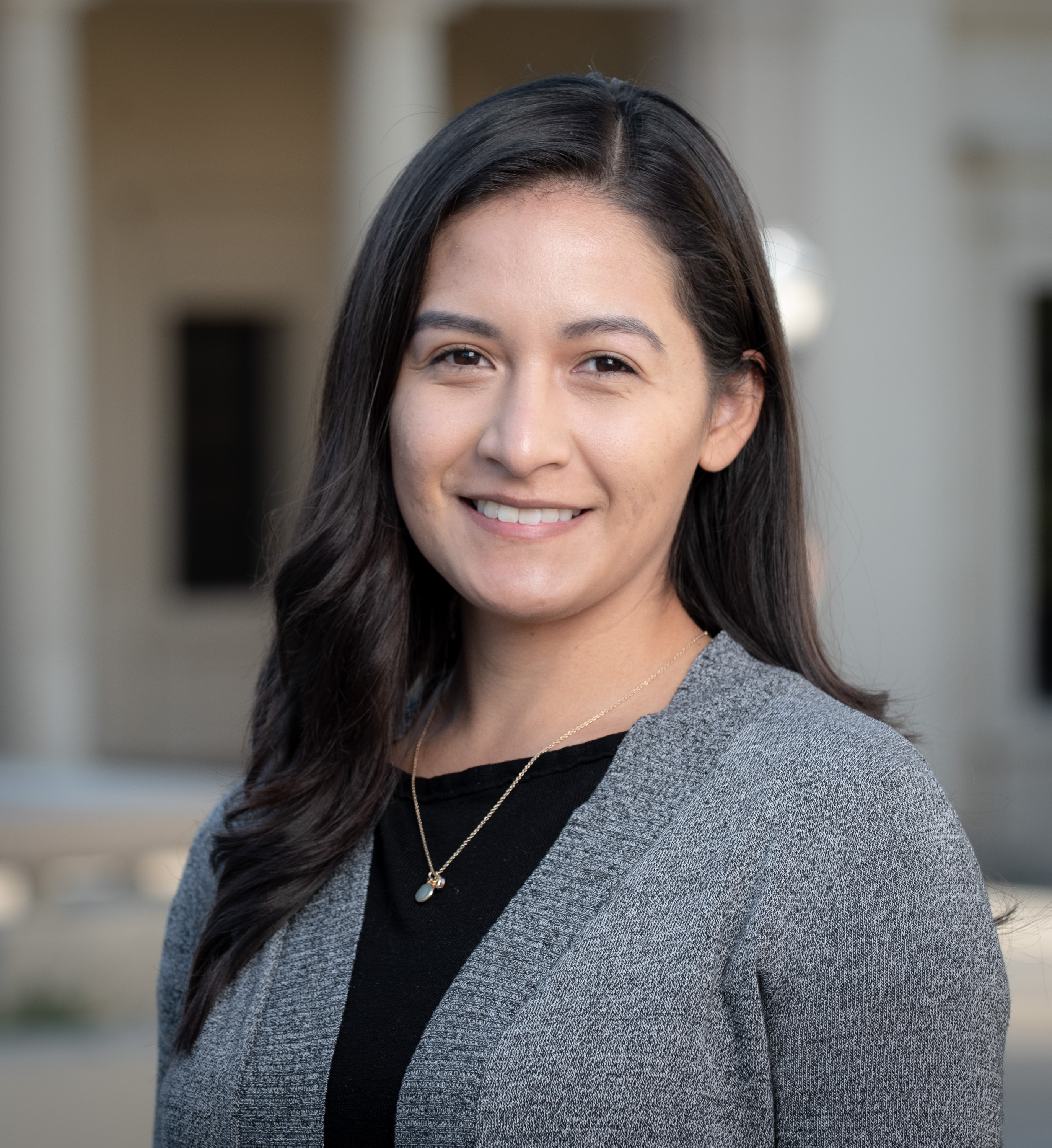 Erica Cisneros wearing gray sweater and black shirt