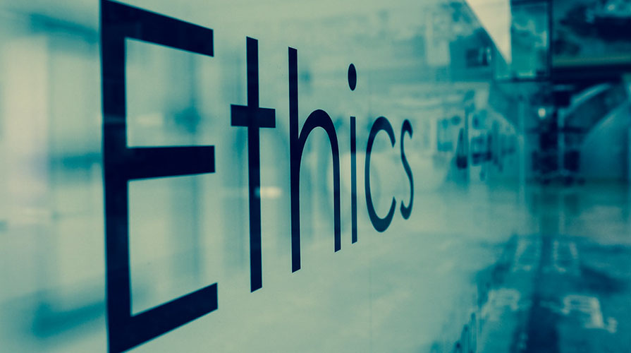 "Ethics" on a glass background