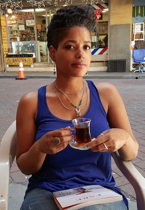 Chai Chats April Banks sits with a cup of tea