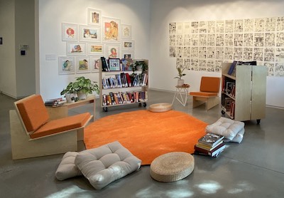 Oxy Arts Community Room with books and chairs 