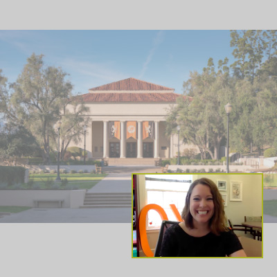 Admission counselor leads information session aided by presentation slide featuring a picture of a campus building