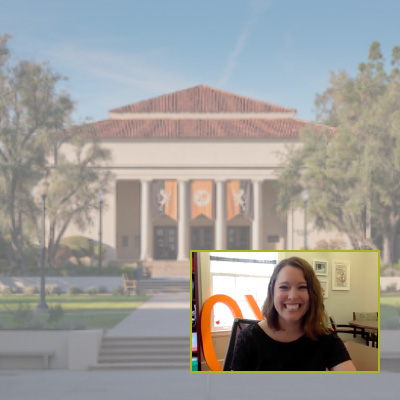 Admission counselor leads information session aided by presentation slide featuring a picture of a campus building