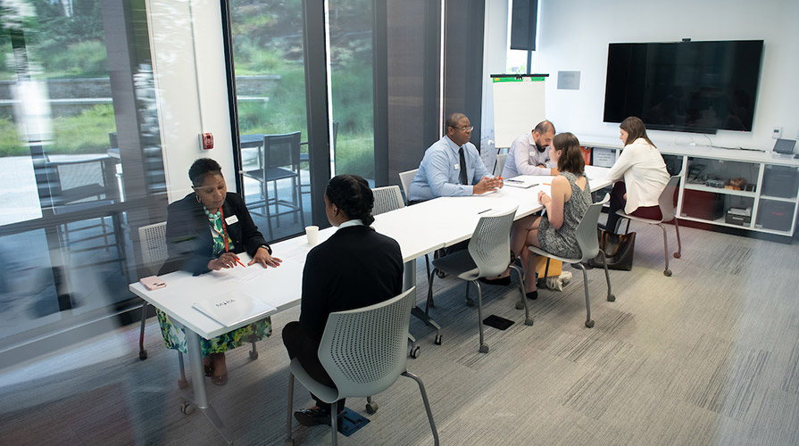 Students talk with career advisors in the Hameetman Career Center