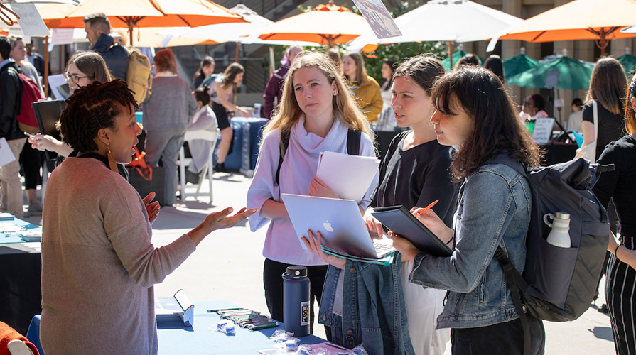 Students talk with employers at the Oxy Career Fair