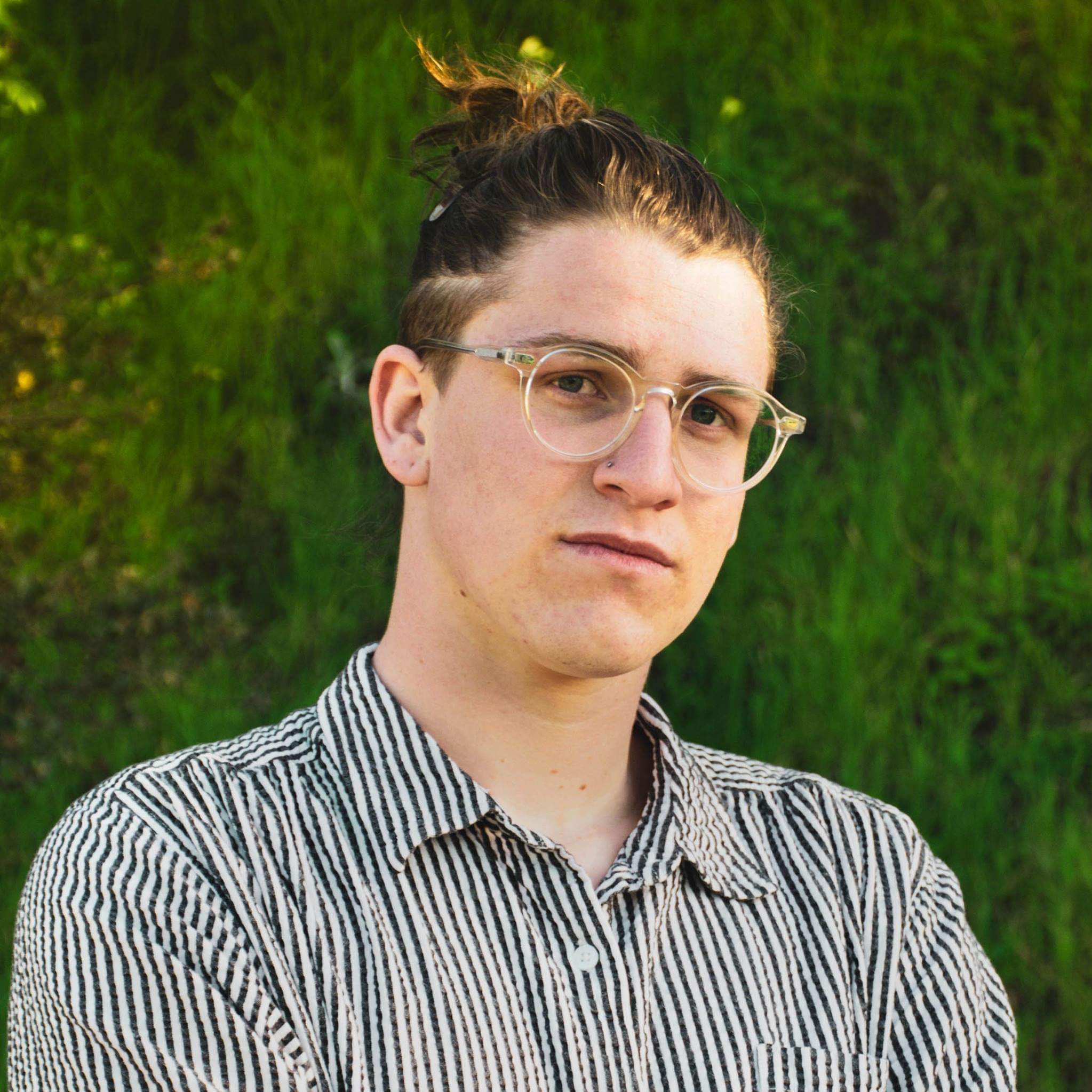 photo of Lachlan with glasses and man bun