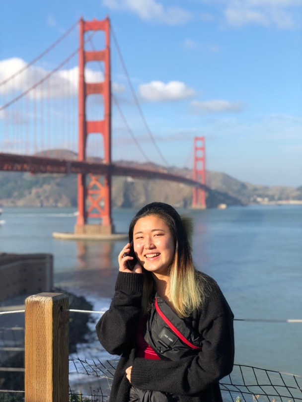 Hyun Gill in front of the Golden Gate Bridge