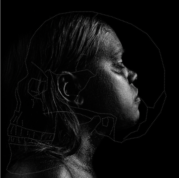 Dark photo of a woman in profile