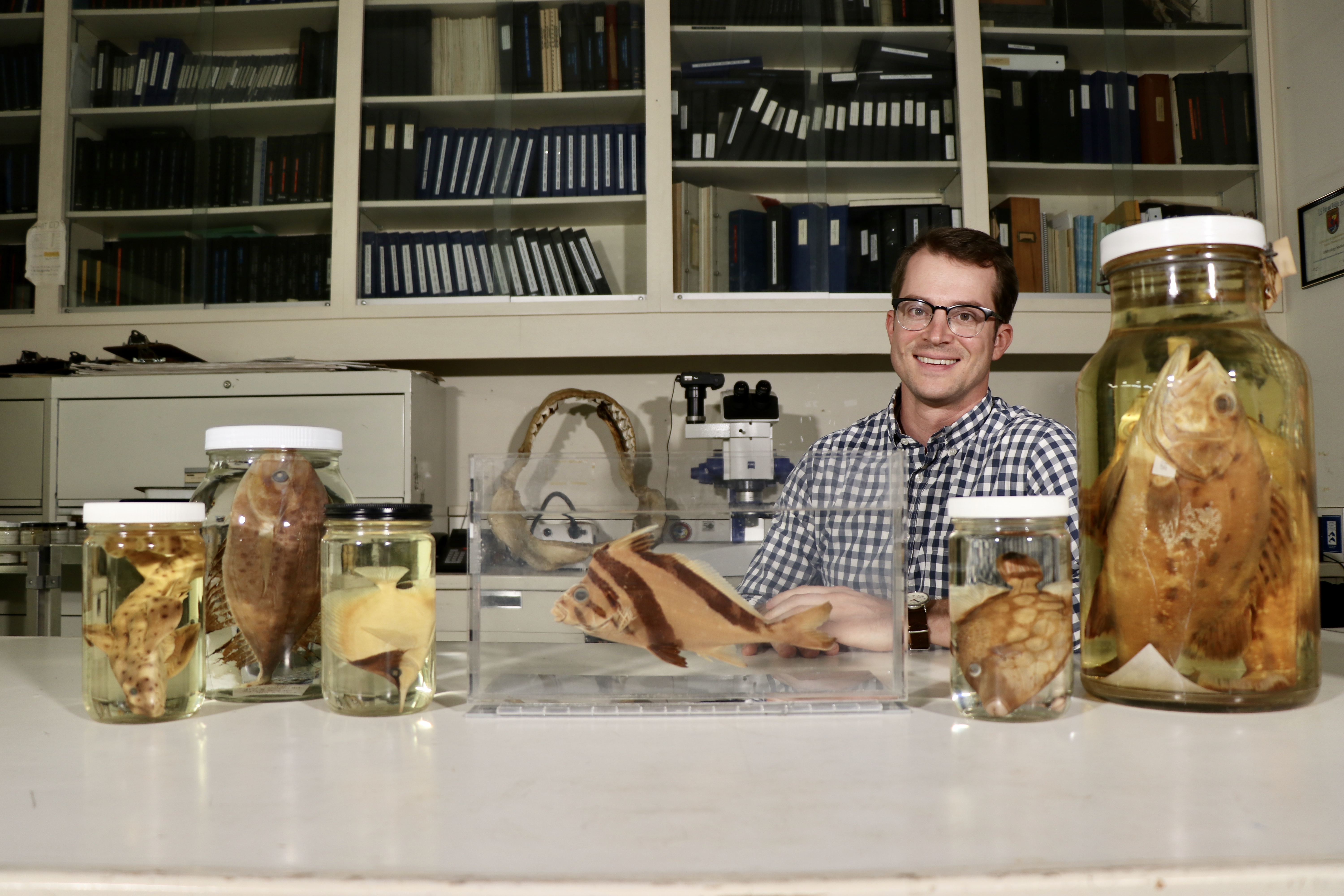 Photo of Dr. Bill Ludt with fish specimens