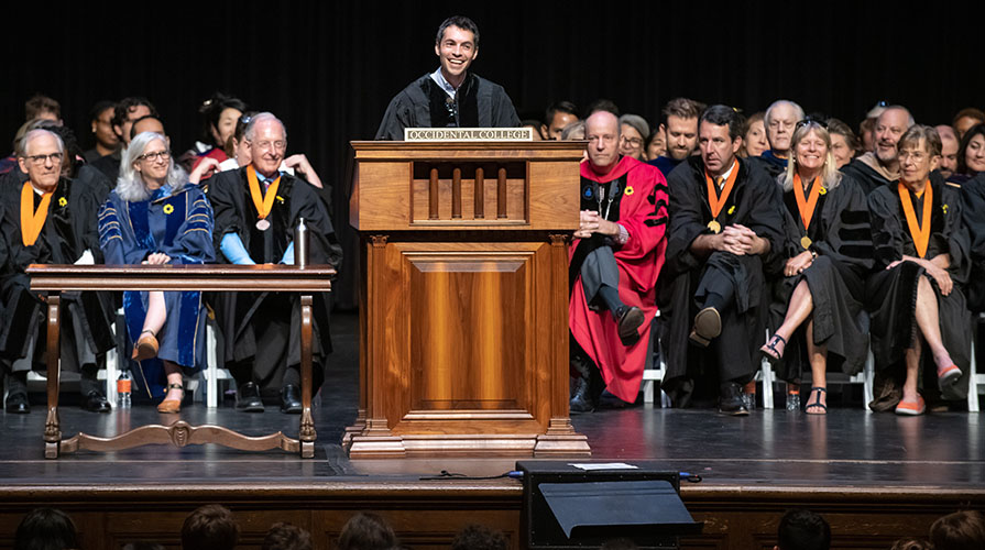 Andrew Jalil talking on stage at Commencement 2018 at Occidental College