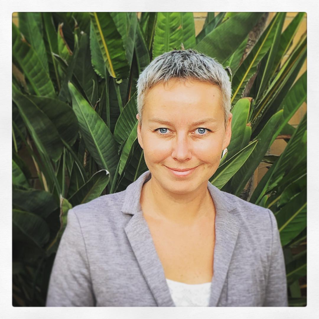 Dr. Katie Zyuzin in front of plants