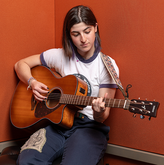 Lily Pesikoff ’26, a music major from Houston, recorded an original composition in the Choi Family Music Production Center for an admission project titled “My Oxy Weekend.”