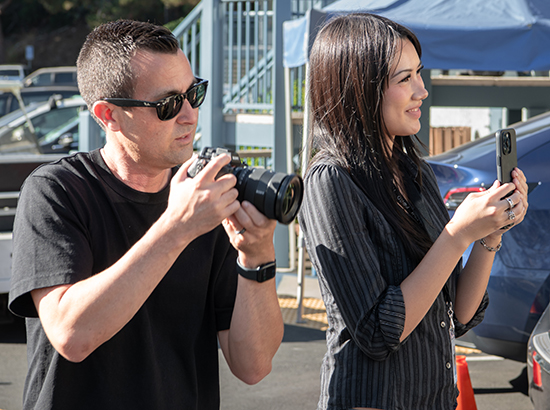 Scott Arenstein '02, senior director of brand at LA Phil, works alongside social intern Penelope Jia '27 at The Ford for a 45th-anniversary screening of the film Zoot Suit on July 8.