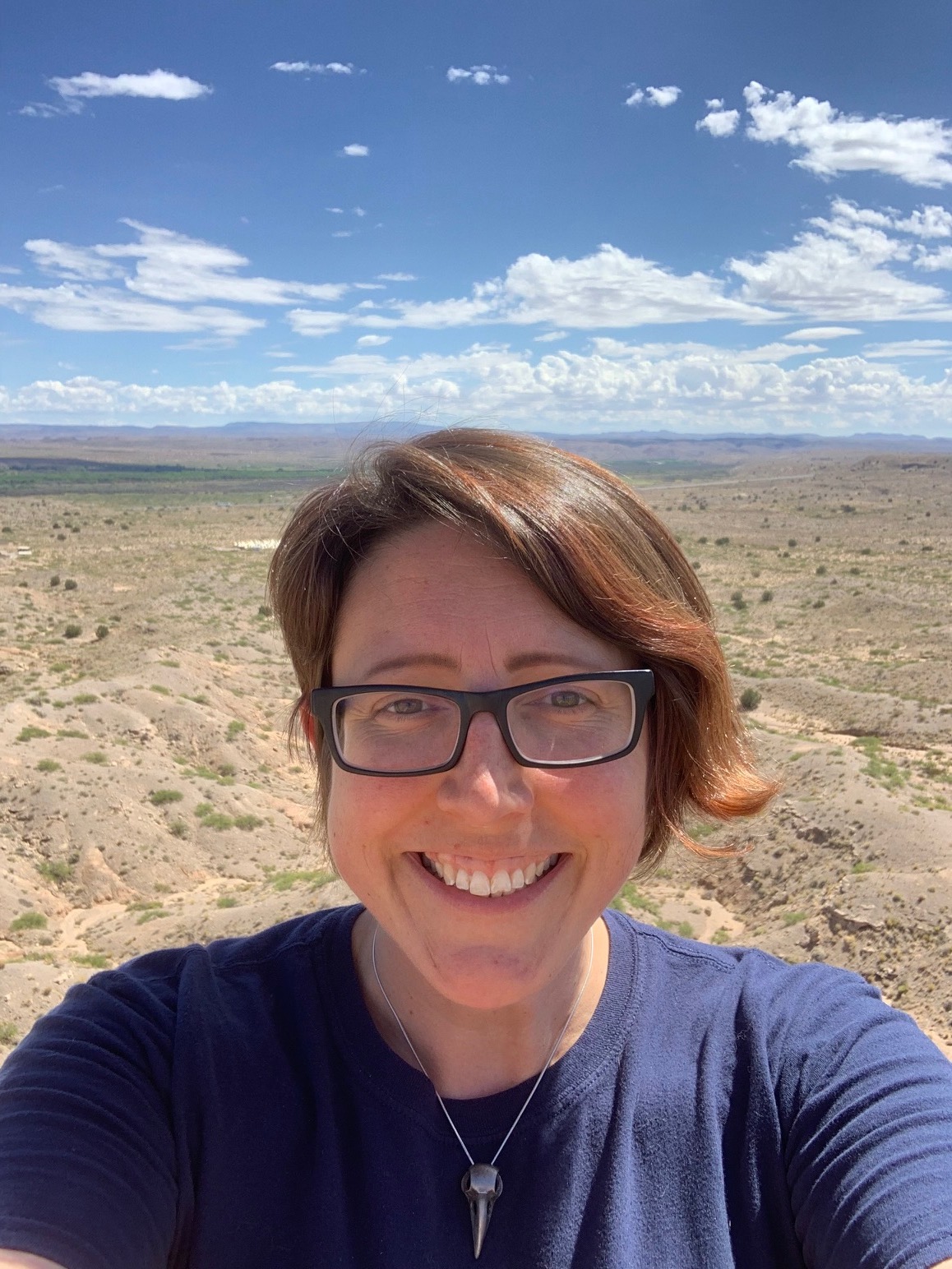 Dr. Kate Boersma in front of desert landscape