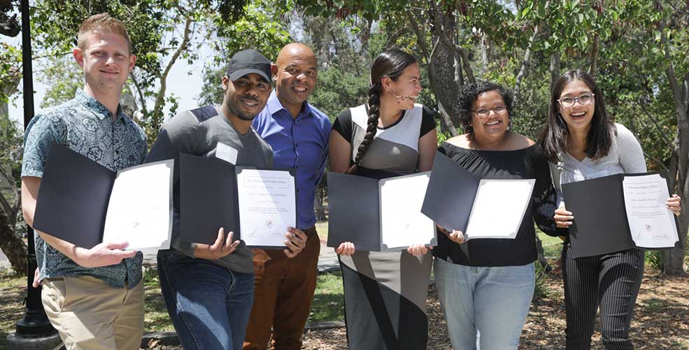 2018 Dean's Awards winners pose with dean Rob Flot