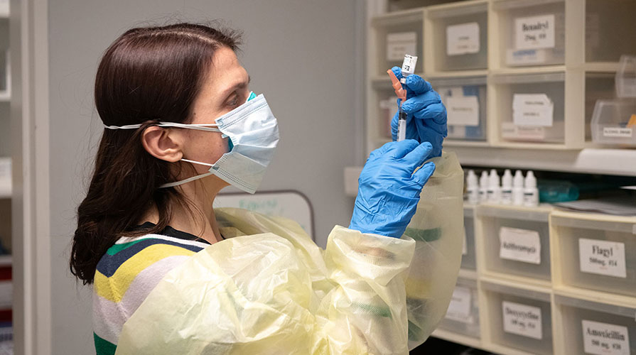 Sara Semal with a COVID vaccine dose