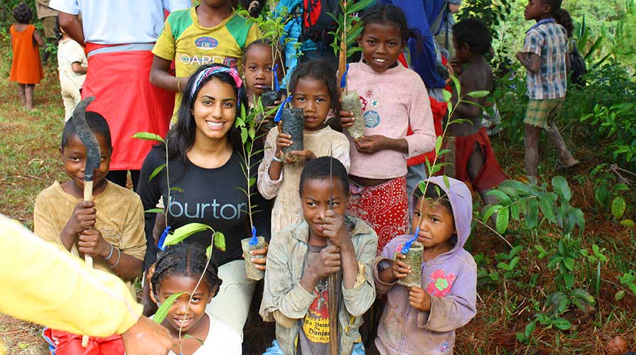 Oxy student with children in Africa