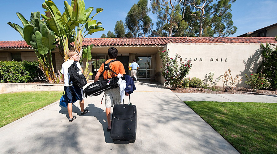 Students walk into Braun Hall