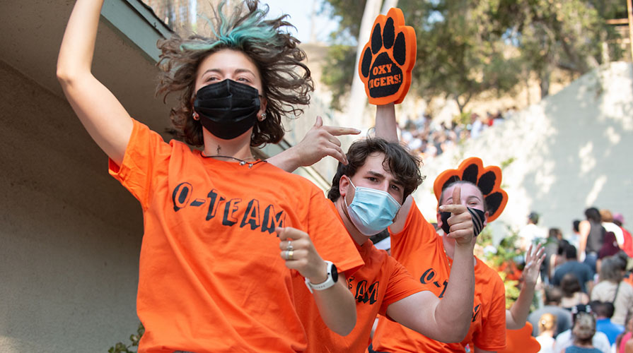 OTeam celebrating new students while wearing masks
