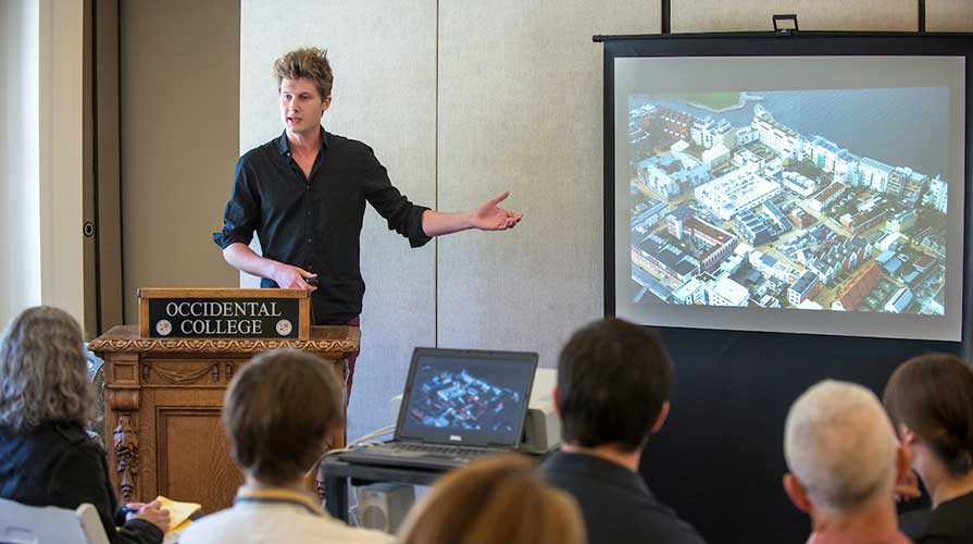 A student presents his international research to a group
