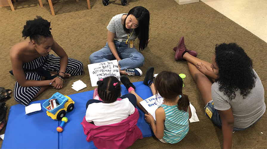 Oxy students volunteering with children