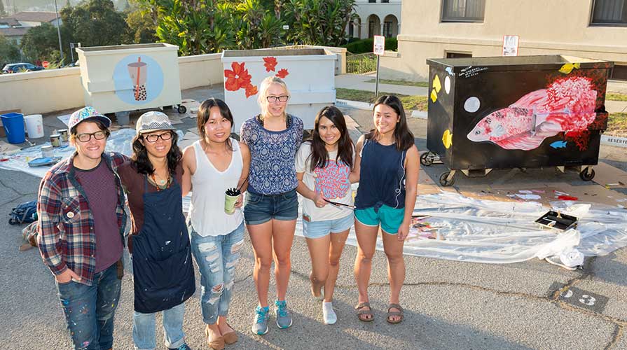 Sustainability-oriented students painting the garbage bins on campus