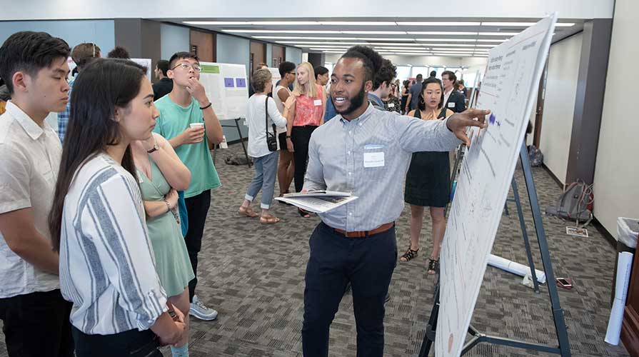 A student presenting his research