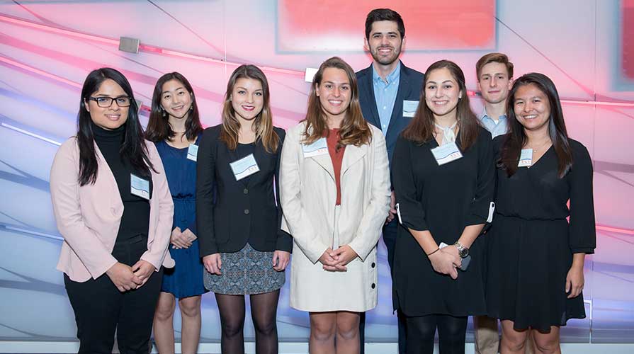 Young Initiative students pose for a photo at an event