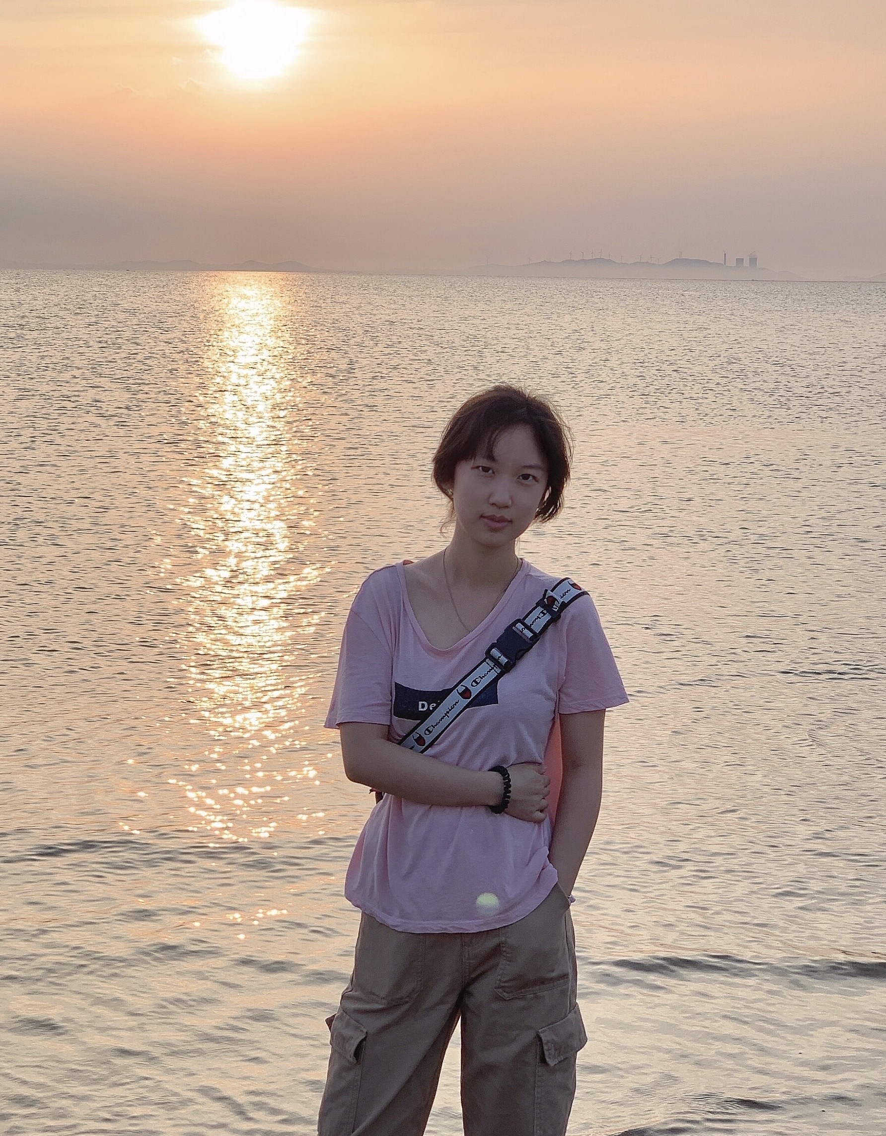 Sherry Gao in front of a sunset
