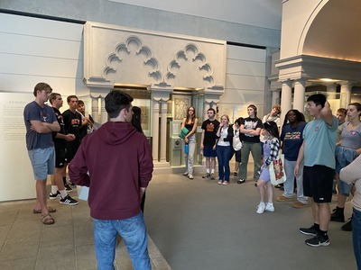 Students listening to a tour guide at the Skirball Cultural Center