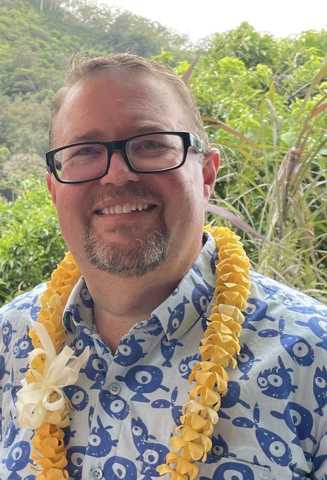 Dr. Spencer Nyholm in front of trees